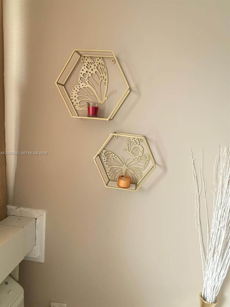 2701 Riverside Drive, Unit 316B Coral Springs, FL 33065 - Photo 4 of 7 a view of small space with racks on the wall