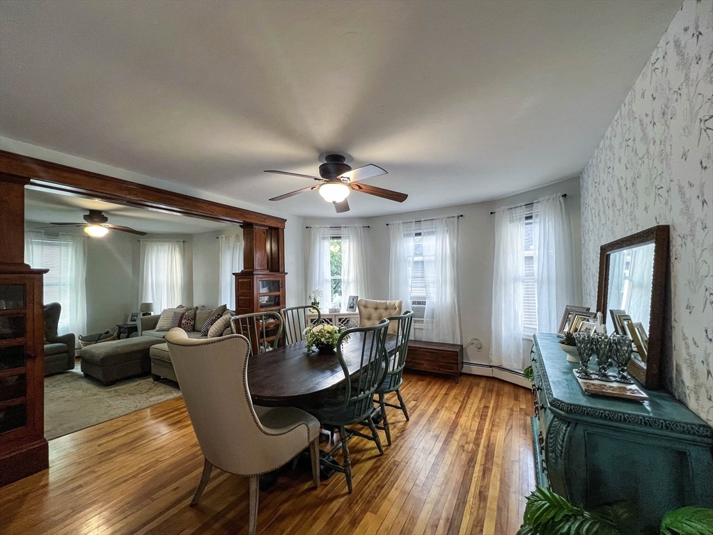 57 Vale Street Worcester, MA 01604 - Photo 11 of 42 a view of a dining room with furniture and wooden floor
