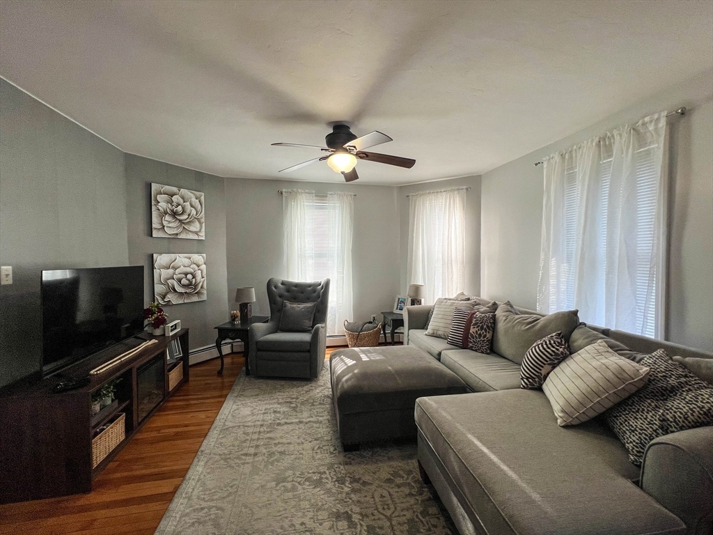 57 Vale Street Worcester, MA 01604 - Photo 13 of 42 a living room with furniture and a flat screen tv