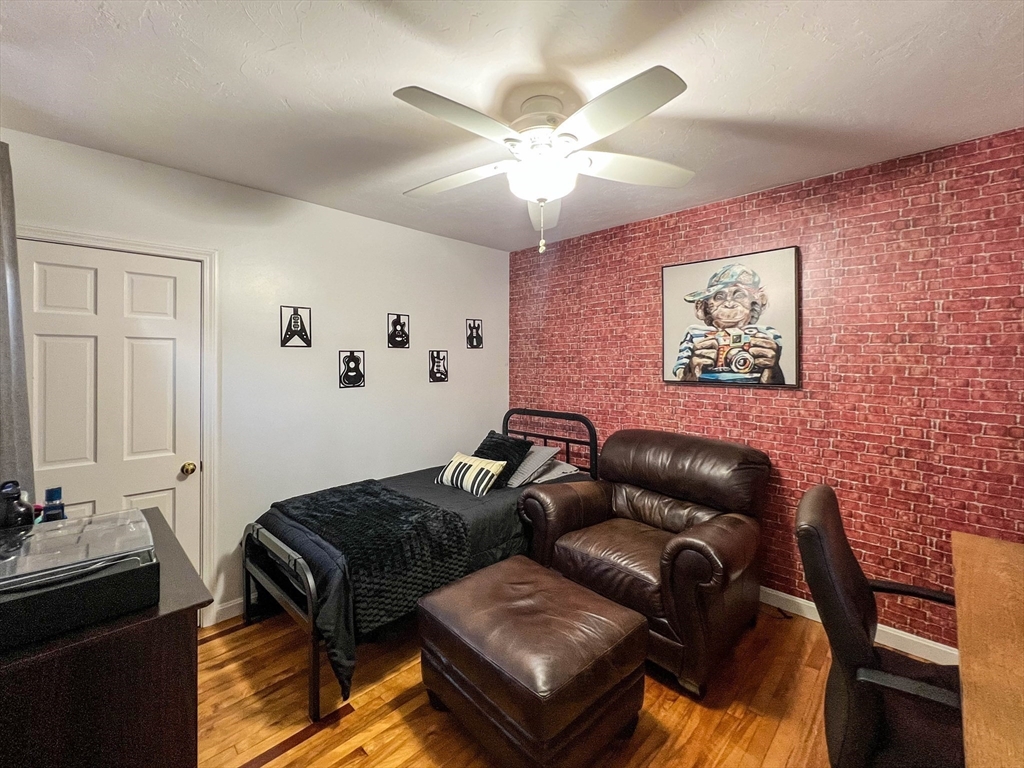 57 Vale Street Worcester, MA 01604 - Photo 15 of 42 a living room with furniture and a ceiling fan