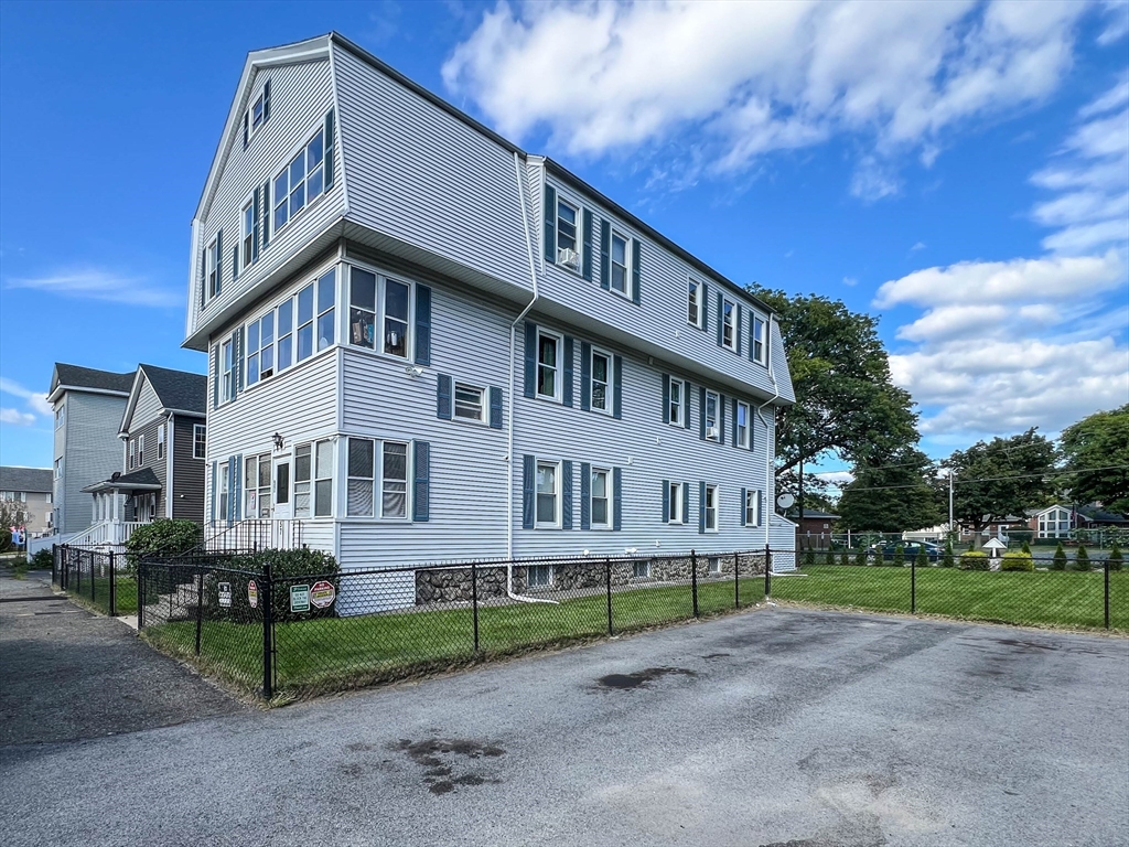57 Vale Street Worcester, MA 01604 - Photo 2 of 42 a view of a big house with a yard