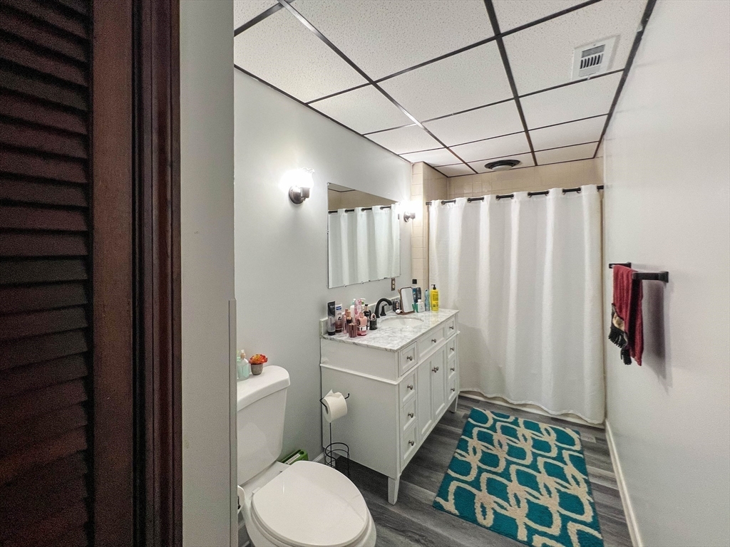 57 Vale Street Worcester, MA 01604 - Photo 21 of 42 a bathroom with a sink toilet and shower