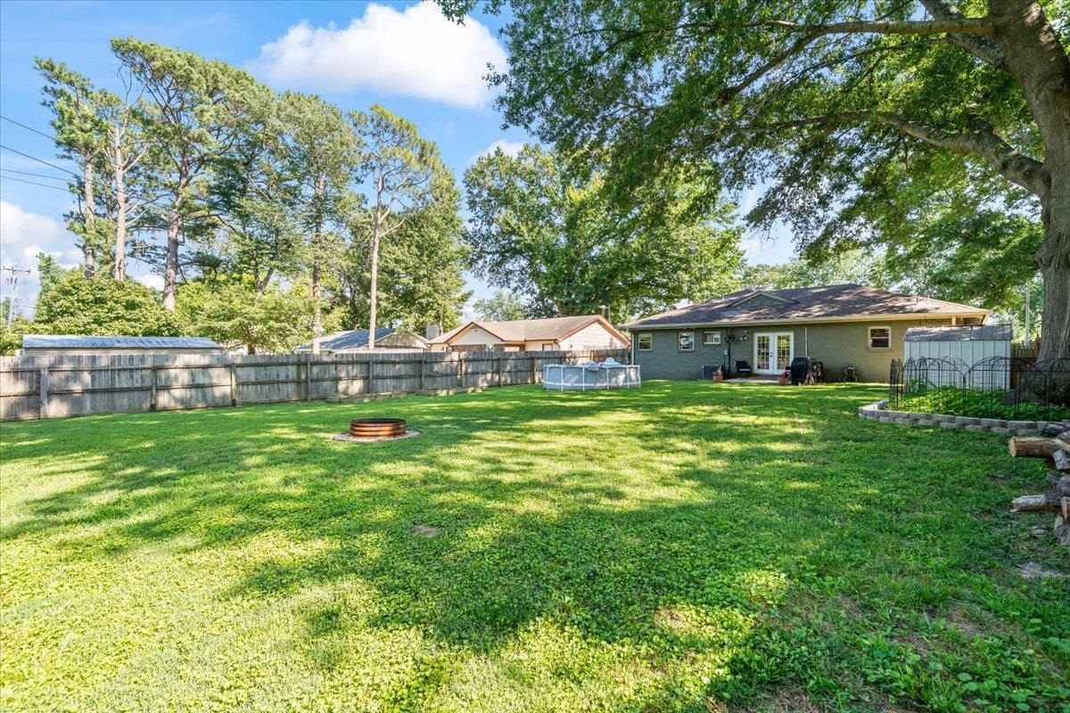 4686 Bill Knight Road Millington, TN 38053 - Photo 24 of 29 Expansive green lawn with mature trees providing partial shade