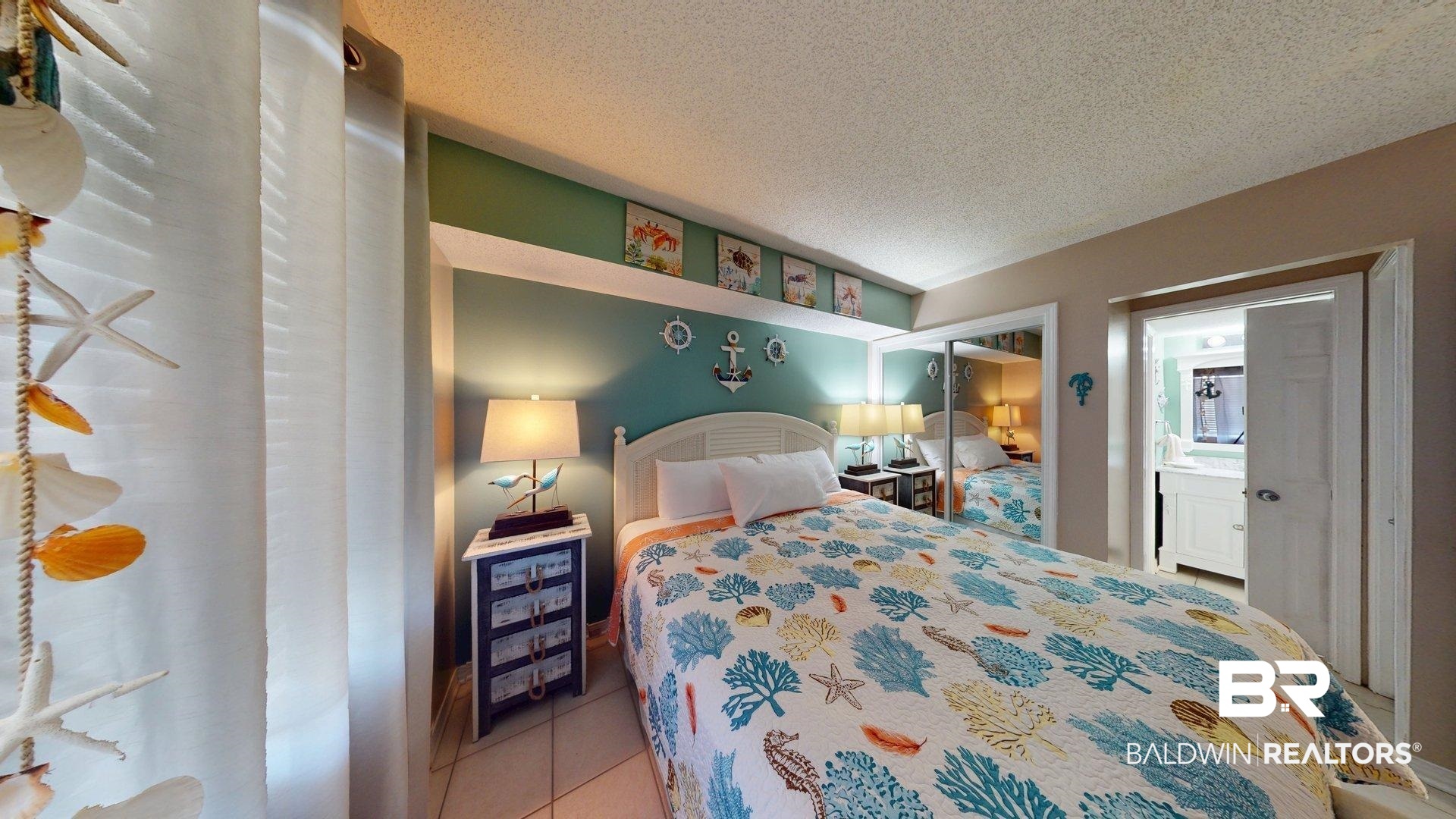 645 Plantation Road, Unit 6503 Gulf Shores, AL 36542 - Photo 47 of 53 Bedroom featuring a textured ceiling, tile patterned floors, and a closet