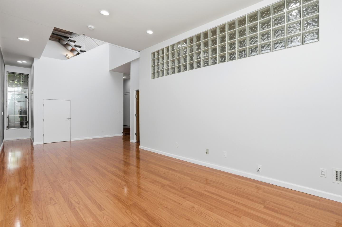 2709 Tenth Street, Unit C Berkeley, CA 94710 - Photo 7 of 44 a view of an empty room with wooden floor
