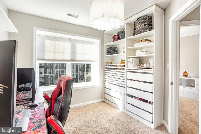 a view of a livingroom with furniture and a window