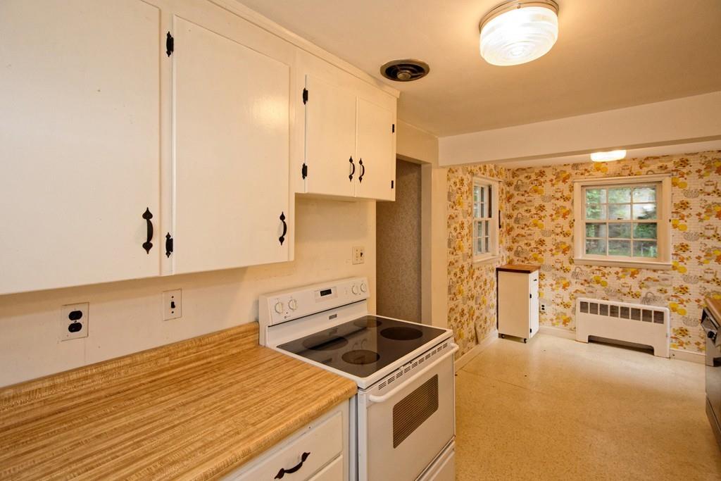 10 Eaton Road Framingham, MA 01701 - Photo 12 of 39 a kitchen with stainless steel appliances granite countertop a stove and a refrigerator