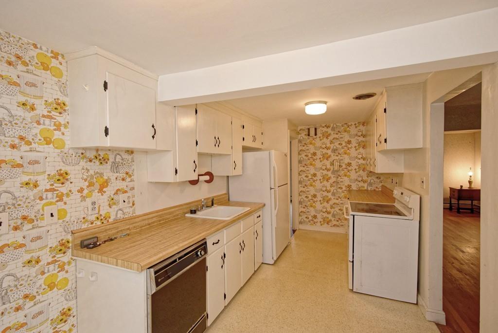 10 Eaton Road Framingham, MA 01701 - Photo 13 of 39 a kitchen with stainless steel appliances a stove and a refrigerator