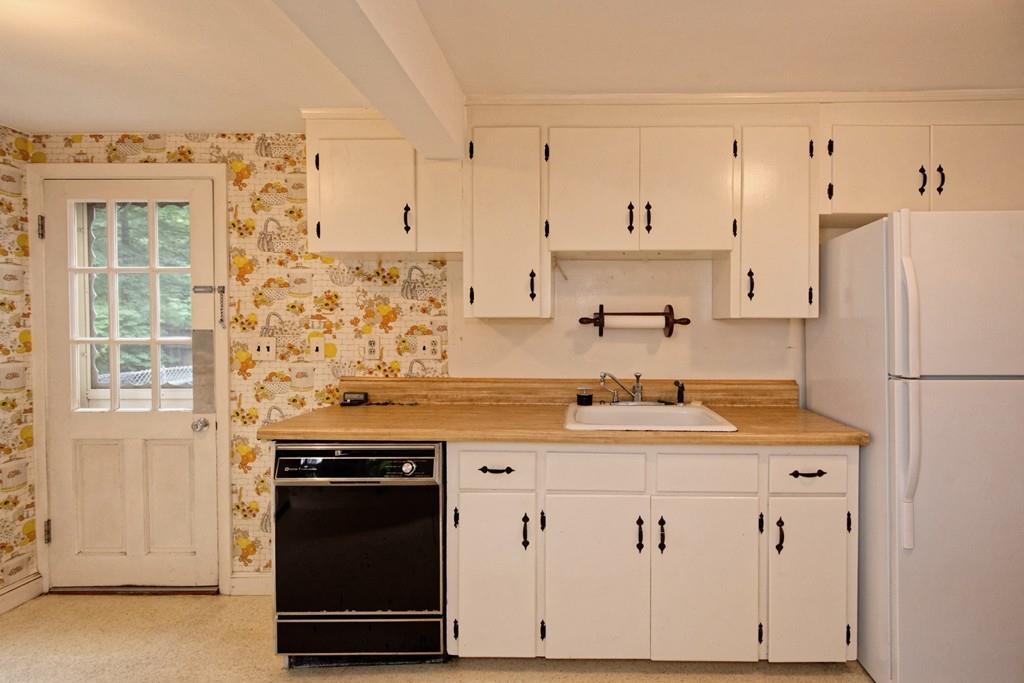 10 Eaton Road Framingham, MA 01701 - Photo 14 of 39 a kitchen with stainless steel appliances granite countertop a refrigerator and a stove