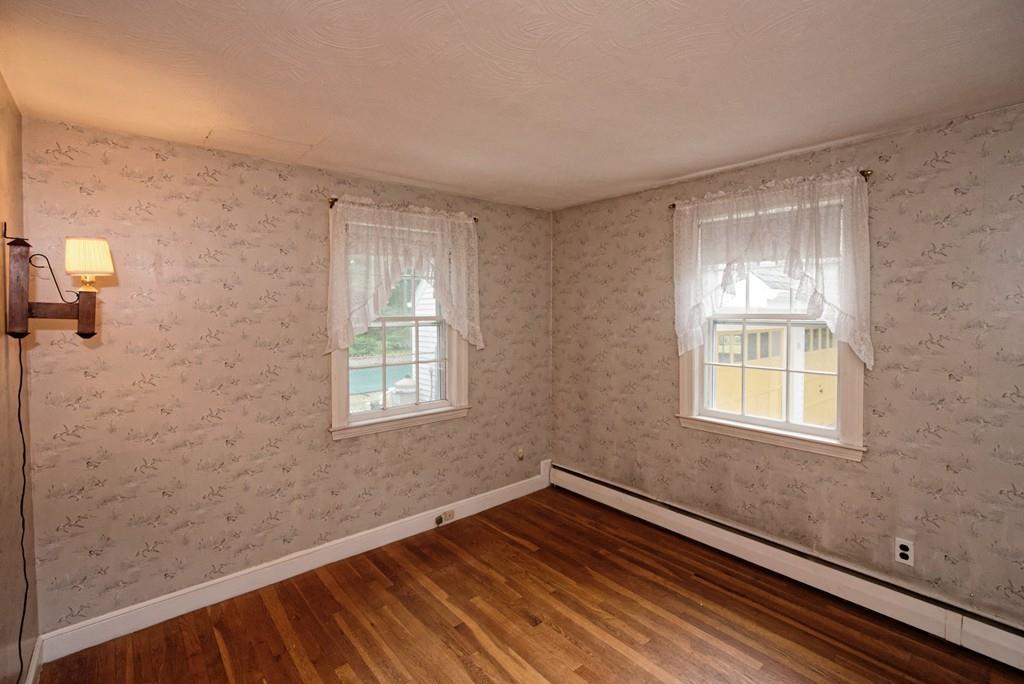 10 Eaton Road Framingham, MA 01701 - Photo 16 of 39 a view of an empty room with wooden floor and a window