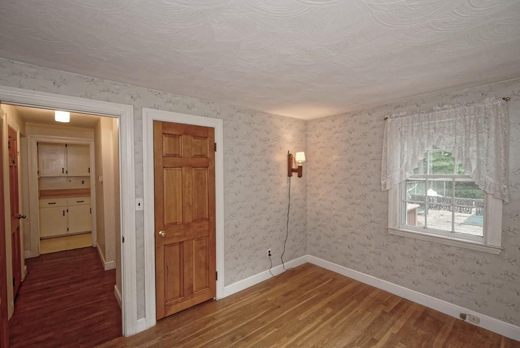 10 Eaton Road Framingham, MA 01701 - Photo 17 of 39 wooden floor in an empty room with a window