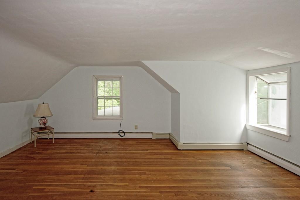 10 Eaton Road Framingham, MA 01701 - Photo 20 of 39 wooden floor in an empty room with a window