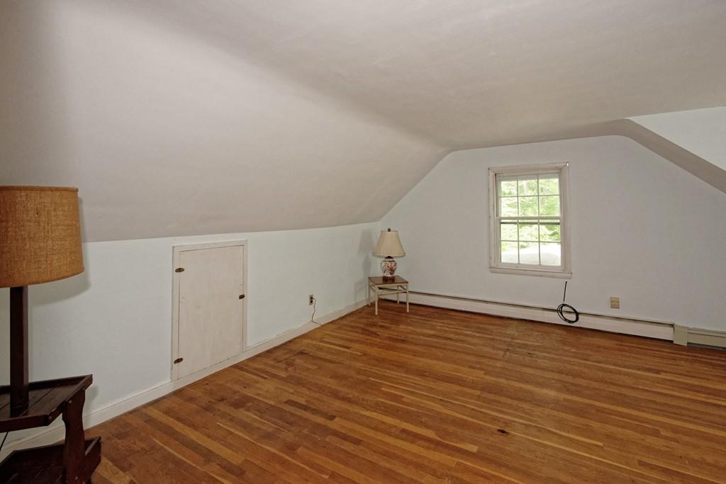 10 Eaton Road Framingham, MA 01701 - Photo 23 of 39 an empty room with wooden floor and windows