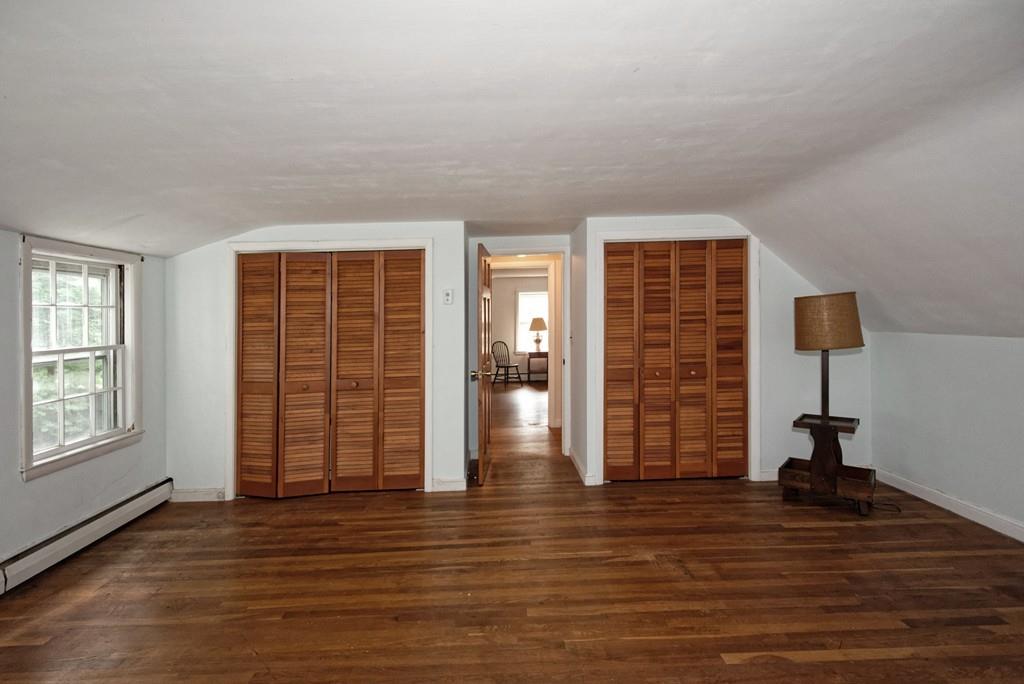 10 Eaton Road Framingham, MA 01701 - Photo 24 of 39 an empty room with wooden floor and windows