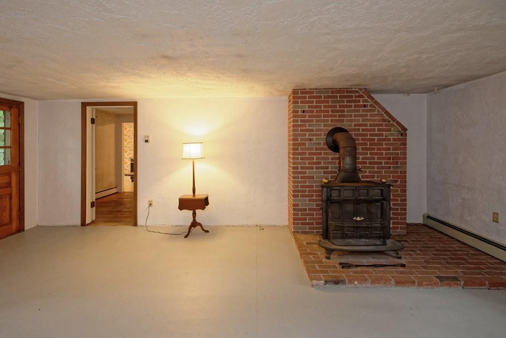 10 Eaton Road Framingham, MA 01701 - Photo 3 of 39 a living room with a fireplace