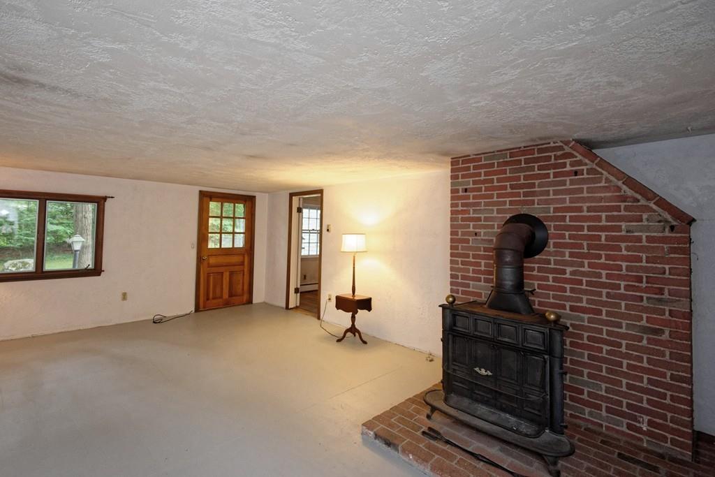 10 Eaton Road Framingham, MA 01701 - Photo 4 of 39 a view of a livingroom with furniture and windows
