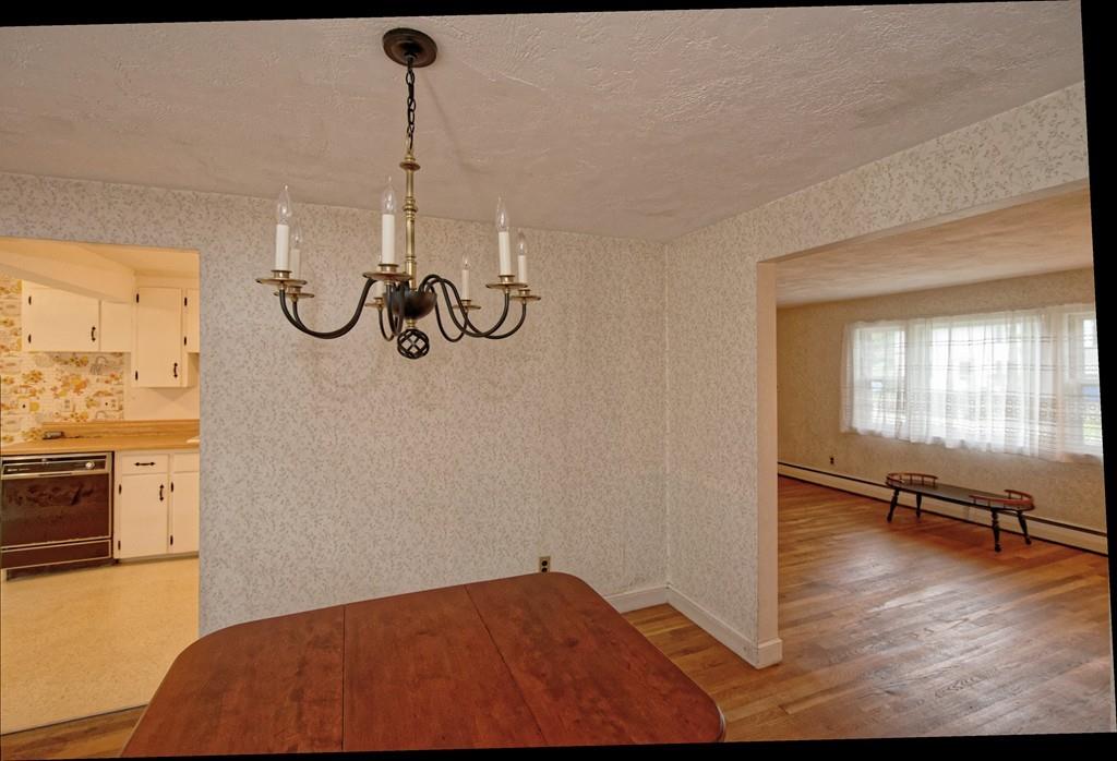 10 Eaton Road Framingham, MA 01701 - Photo 7 of 39 a bedroom with a bed and a chandelier