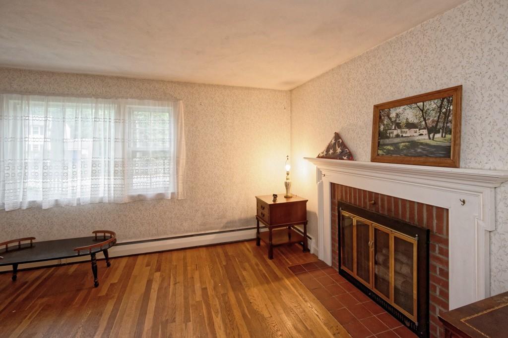 10 Eaton Road Framingham, MA 01701 - Photo 8 of 39 a view of livingroom with furniture flat screen tv and staircase