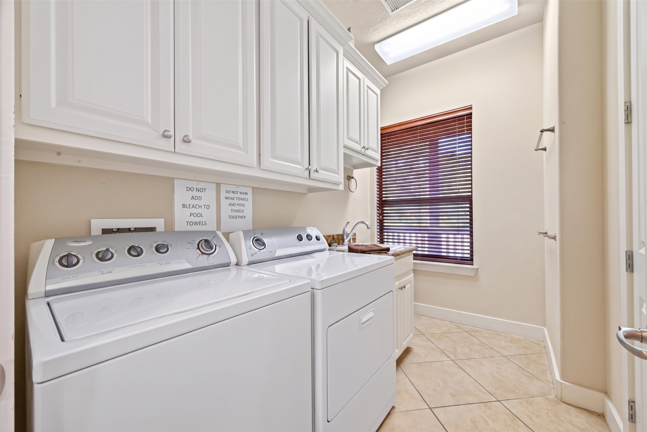 8 Smith Loop South Cleveland, TX 77327 - Photo 11 of 29 Laundry is right off the kitchen.