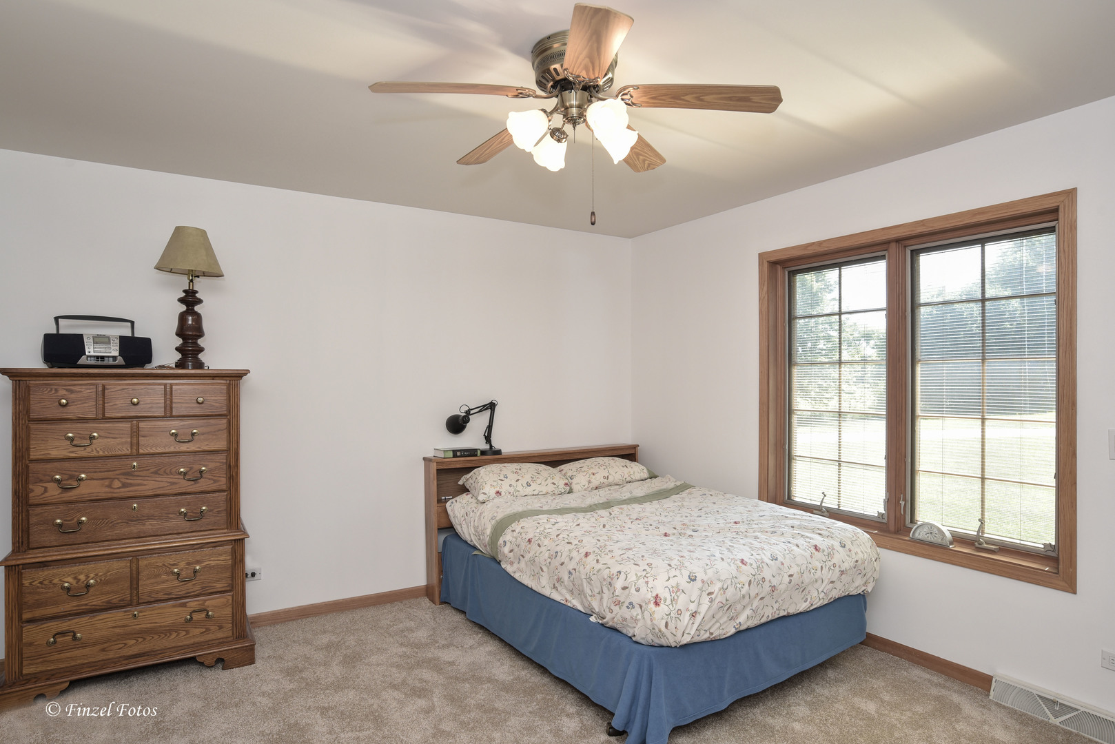 23504 Flat Iron Road Harvard, IL 60033 - Photo 13 of 27 a bedroom with a bed and a dresser