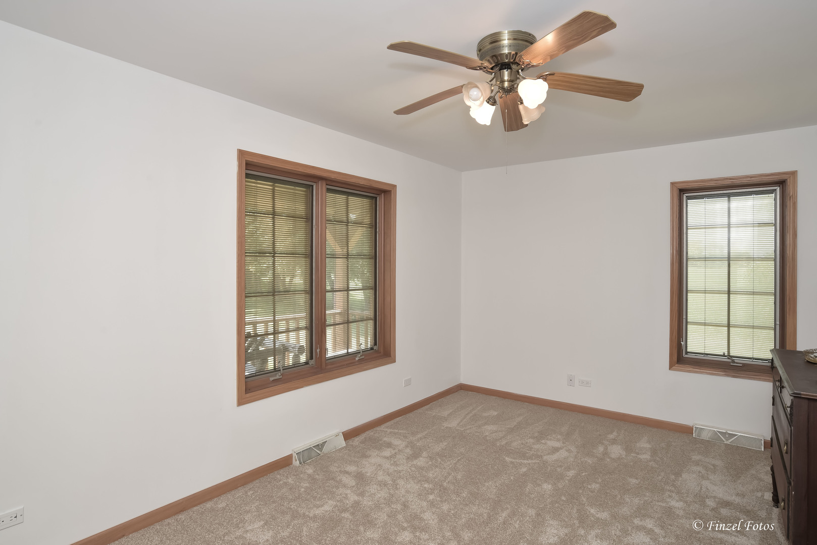 23504 Flat Iron Road Harvard, IL 60033 - Photo 16 of 27 an empty room with windows and fan