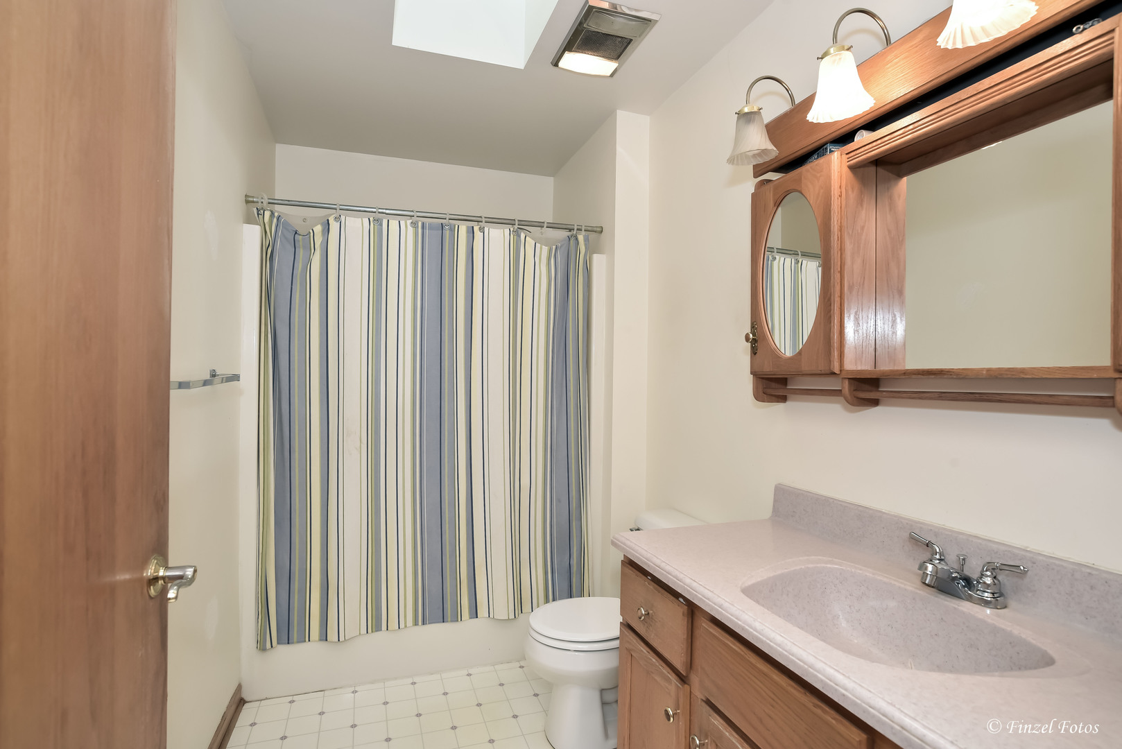 23504 Flat Iron Road Harvard, IL 60033 - Photo 17 of 27 a bathroom with a sink a toilet and a mirror