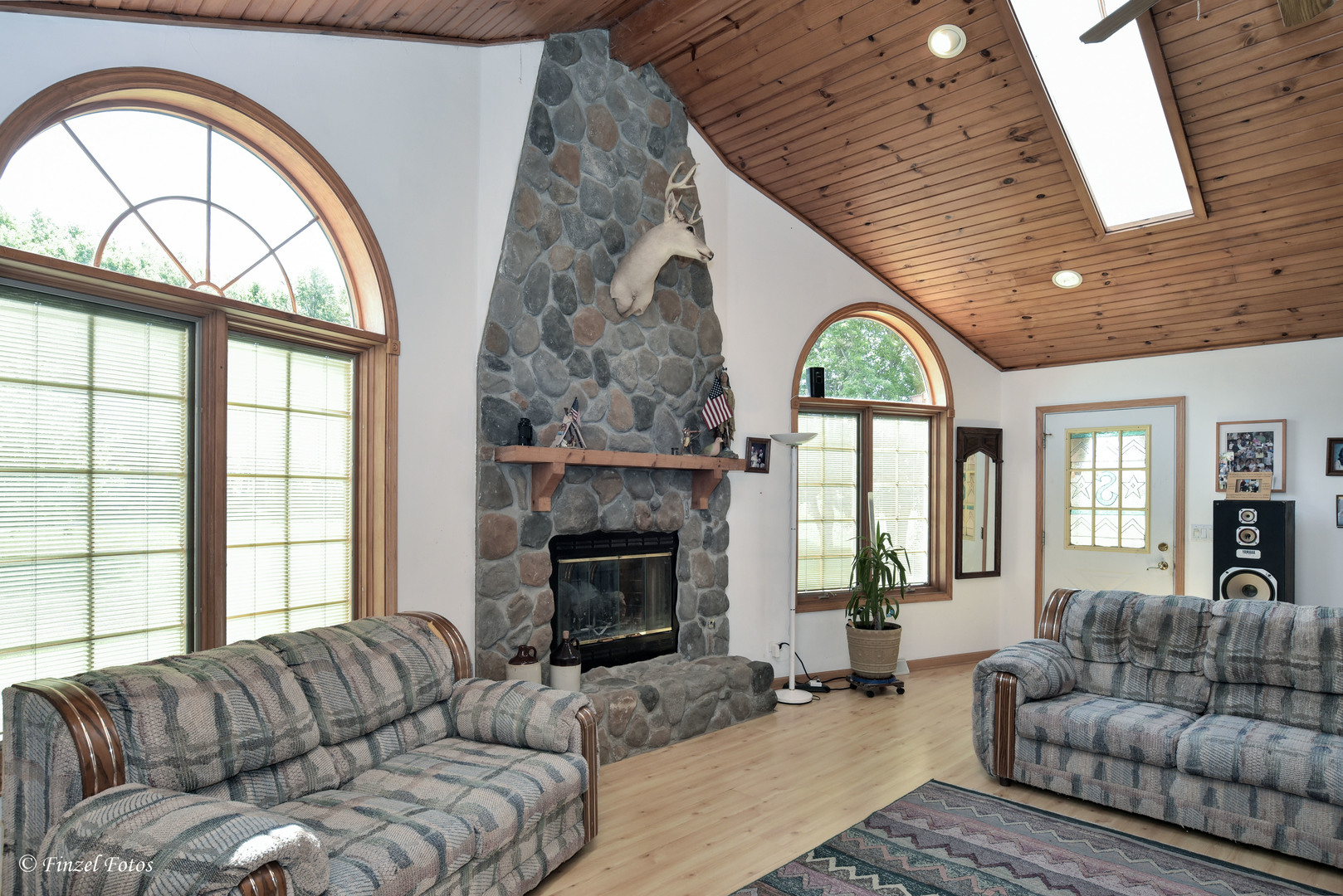 23504 Flat Iron Road Harvard, IL 60033 - Photo 7 of 27 a living room with a fireplace furniture a fireplace and a large window
