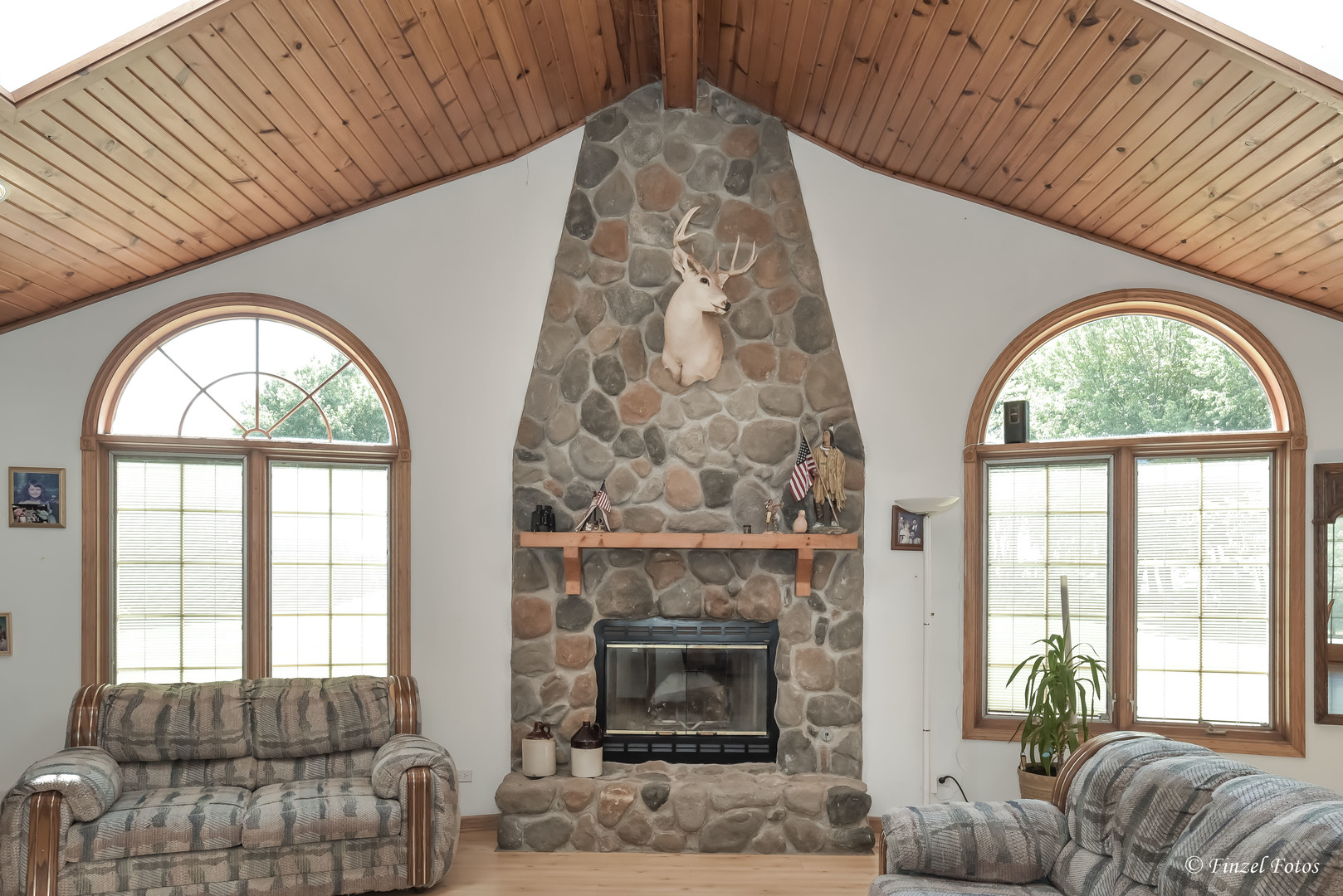 23504 Flat Iron Road Harvard, IL 60033 - Photo 9 of 27 a living room with furniture a fireplace and a large window