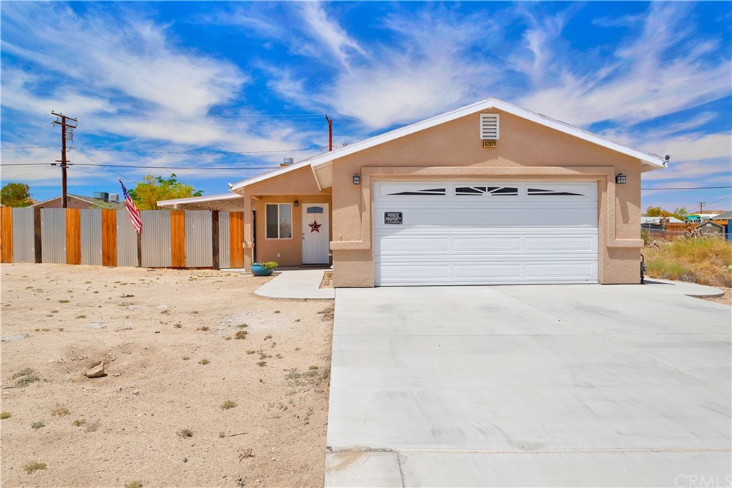 62020 Bonair Road Joshua Tree, CA 92252 - Photo 1 of 1 a front view of a house with a yard