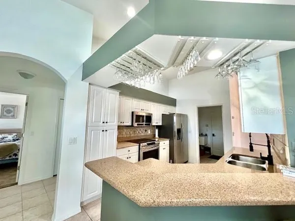 a kitchen with a table and chairs in it