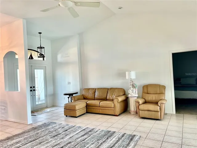 a spacious bathroom with a tub sink and mirror