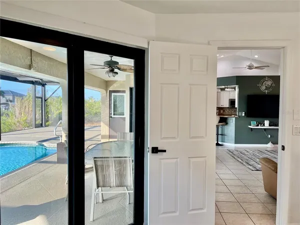 a bathroom with a sink mirror and shower