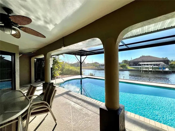 a view of swimming pool with a patio