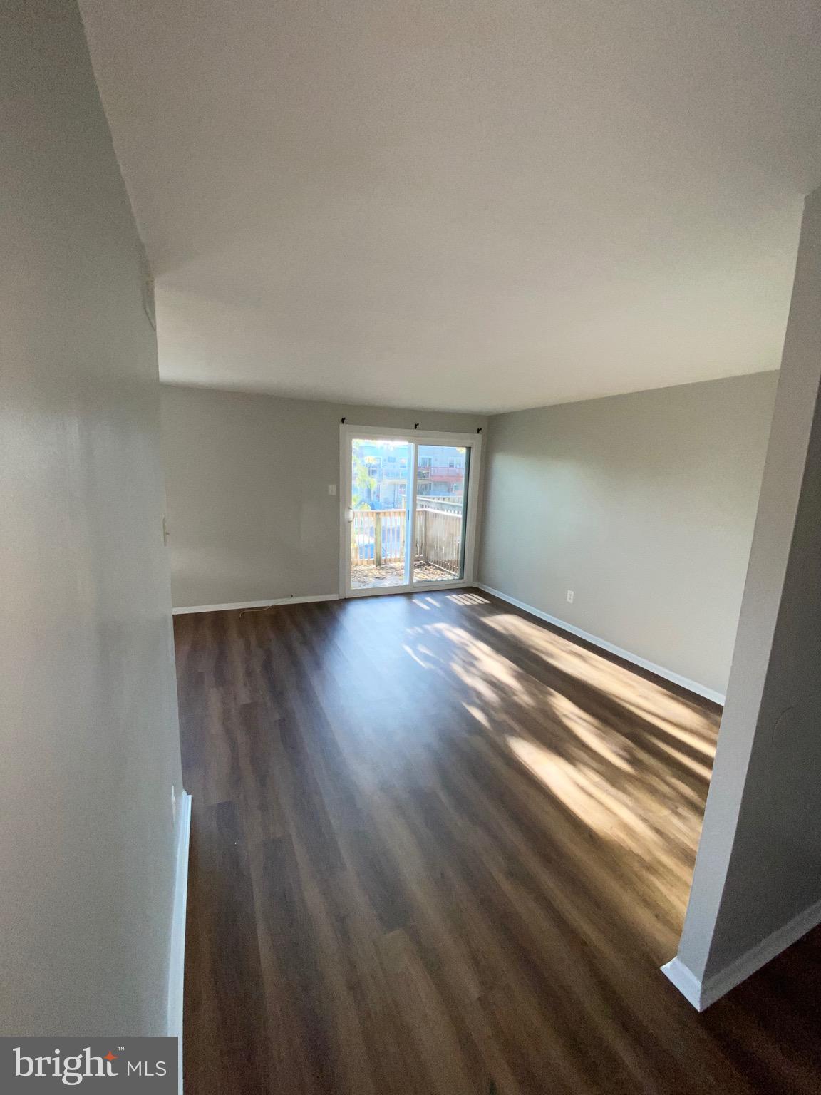3408 Ashfield Lane Philadelphia, PA 19114 - Photo 6 of 13 an empty room with wooden floor and windows