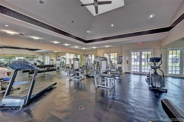 a room with lots of wooden furniture and white walls