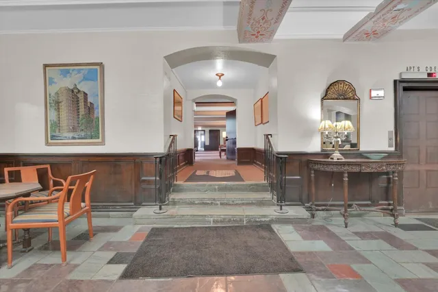 a living room with fireplace furniture and a fireplace
