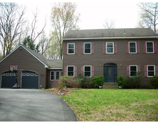 133 Old Stage Road Hatfield, MA 01088 - Photo 1 of 1 a front view of a house with a yard and garage