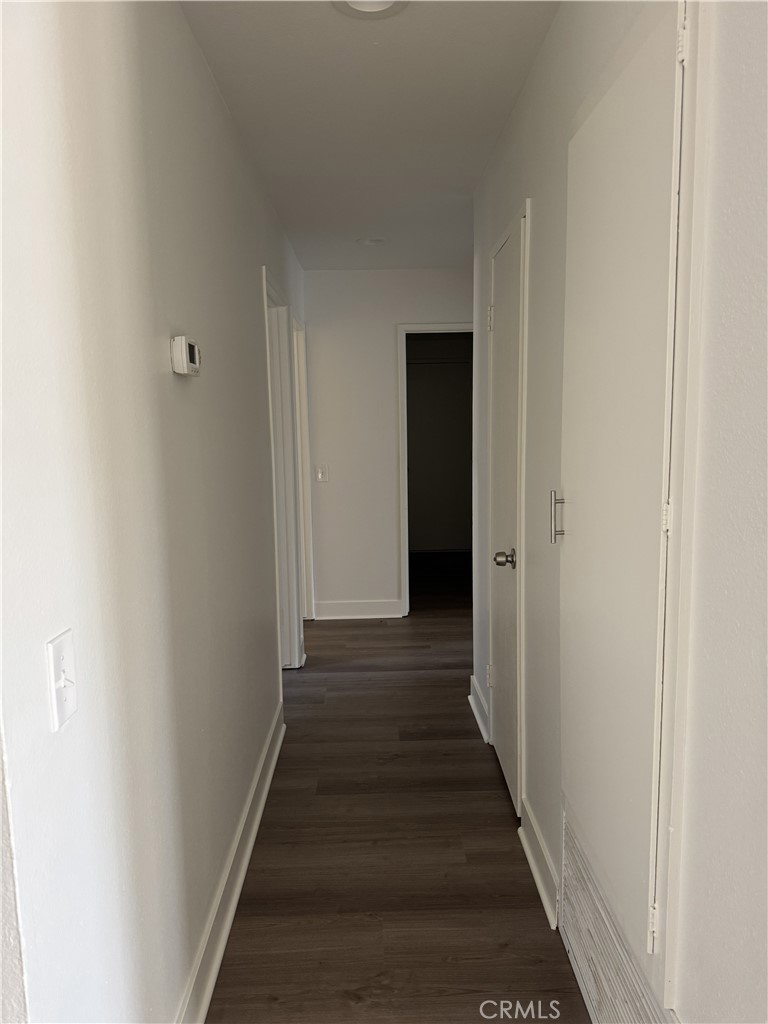15521 Saddleback Road Woodcrest, CA 92506 - Photo 18 of 24 a view of a hallway with the wooden floor