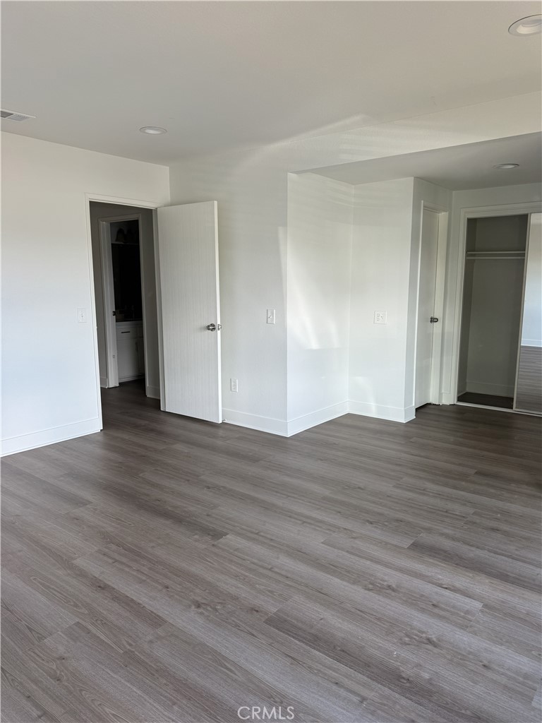 15521 Saddleback Road Woodcrest, CA 92506 - Photo 21 of 24 a view of an empty room with wooden floor