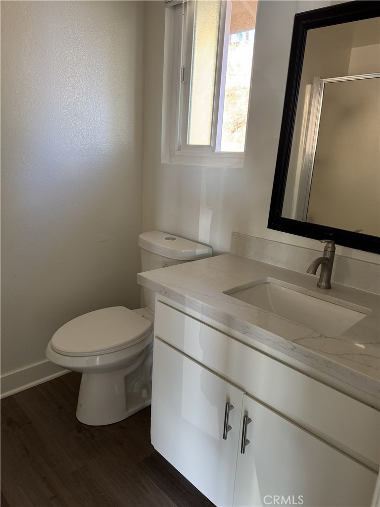15521 Saddleback Road Woodcrest, CA 92506 - Photo 22 of 24 a bathroom with a toilet sink and mirror