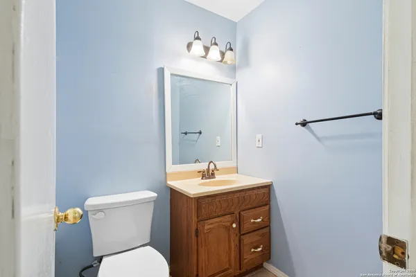 a view of storage and utility room with a window