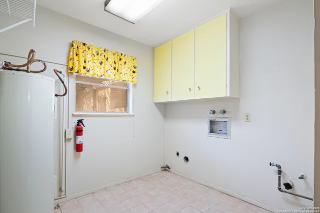 a view of an empty room with cabinet