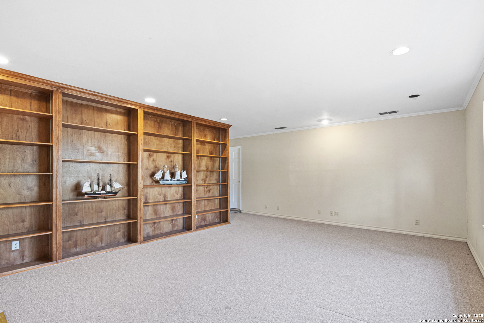 715 Studer Street Uvalde, TX 78801 - Photo 16 of 44 a view of an empty room with cabinet