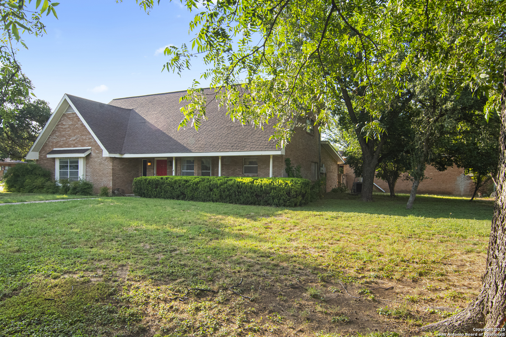 715 Studer Street Uvalde, TX 78801 - Photo 2 of 44 a view of a house with a yard
