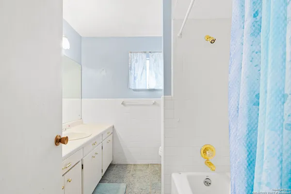 a room with a bed and a window