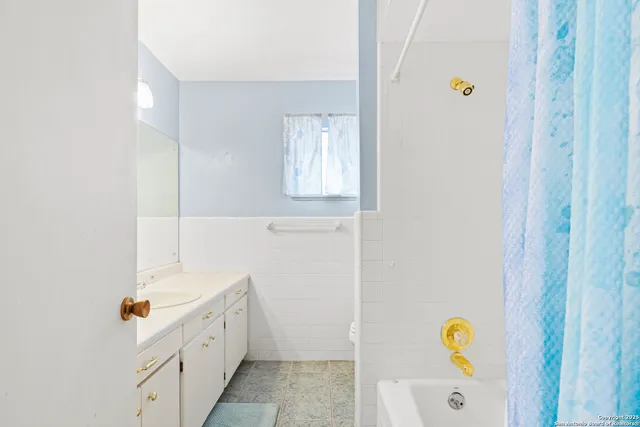 a room with a bed and a window