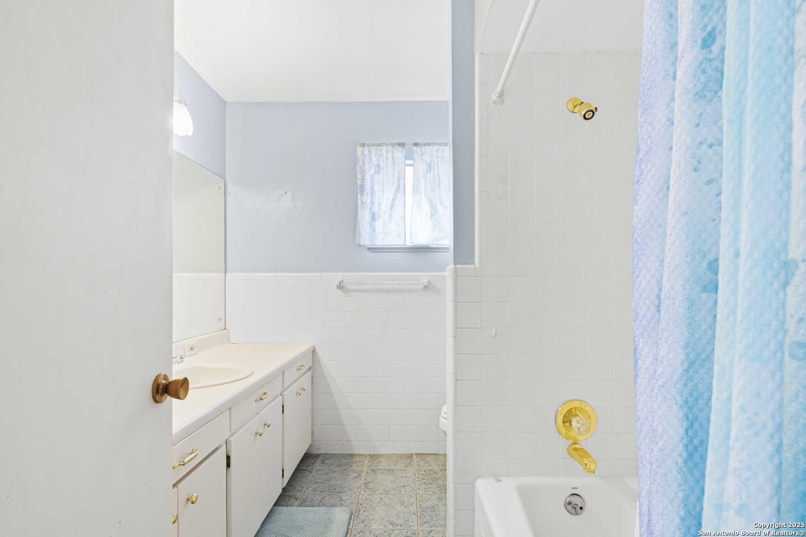 715 Studer Street Uvalde, TX 78801 - Photo 26 of 44 a bathroom with a sink a window and a shower