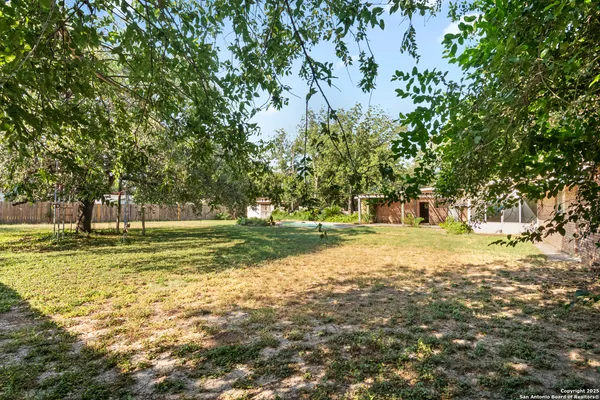 an aerial view of house with swimming pool