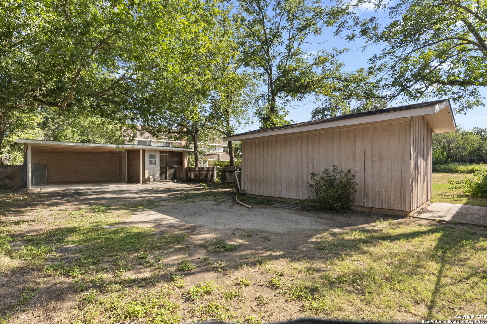 715 Studer Street Uvalde, TX 78801 - Photo 42 of 44 a view of a backyard with a tree