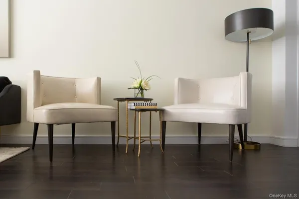 a living room with furniture and a lamp